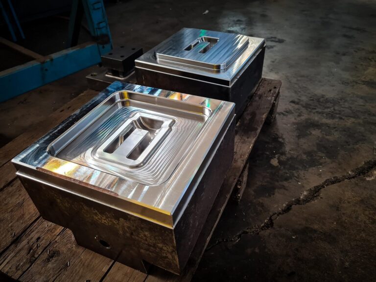 Pair of precision CNC-milled steel dies for closed die forging, machined in-house at Bensch Forge